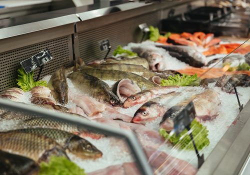 Showcase with raw fish at the supermarket